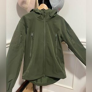 Green zip up hoodie. Wind/water resistant